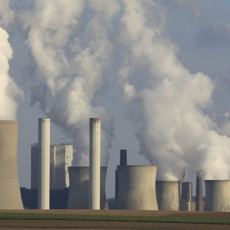 Cooling towers in action at a coal-fired power station