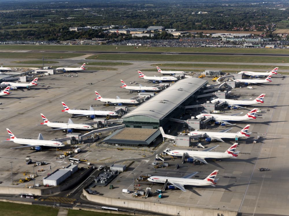 aerial photo of planes at Heathrow terminal