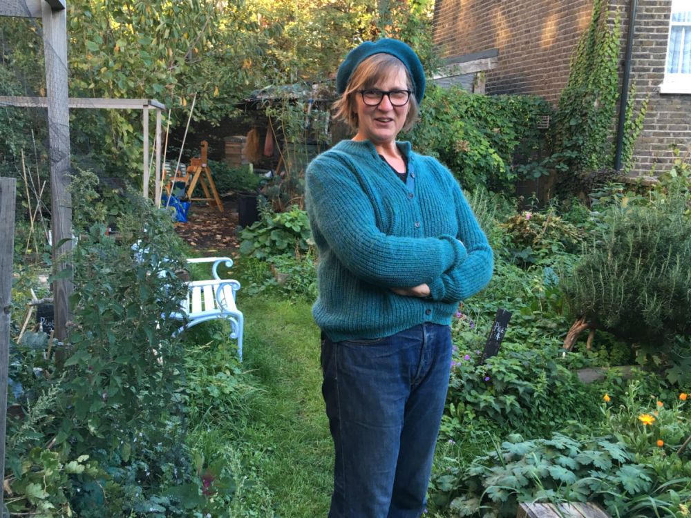 Kate Poland, the postcode gardener for Daubeney Road in Hackney, standing in her garden