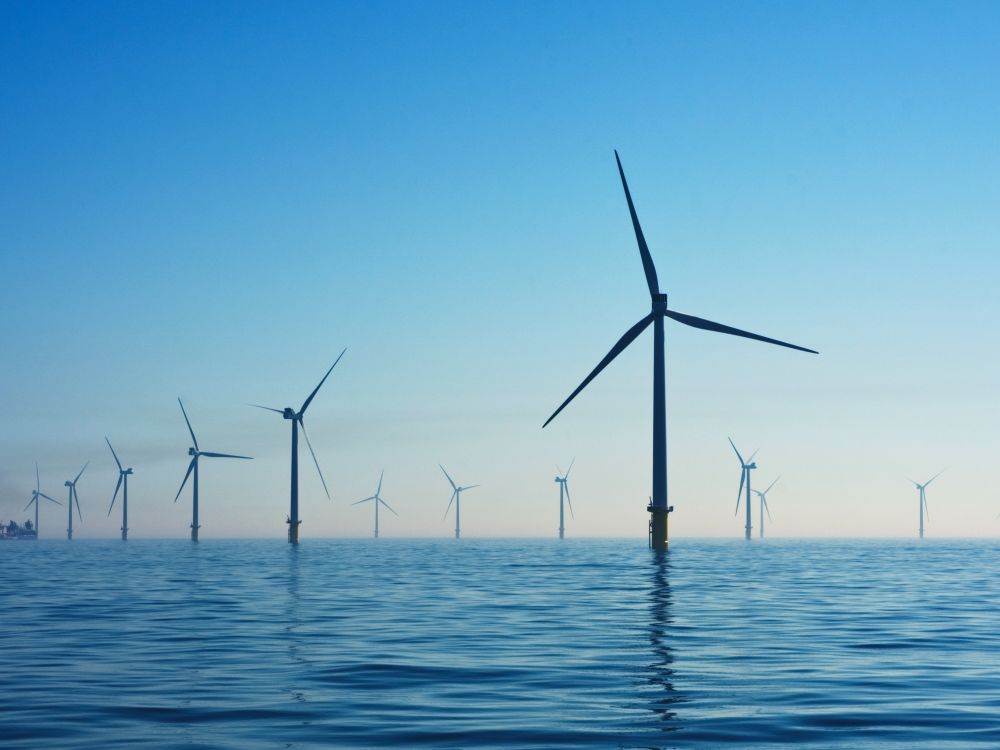 Several wind turbines in the ocean