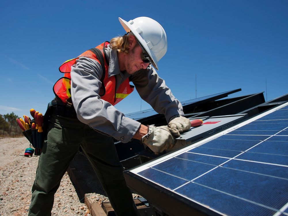 Man installing solar panel