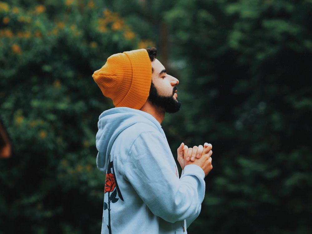 Young man with clasped hands