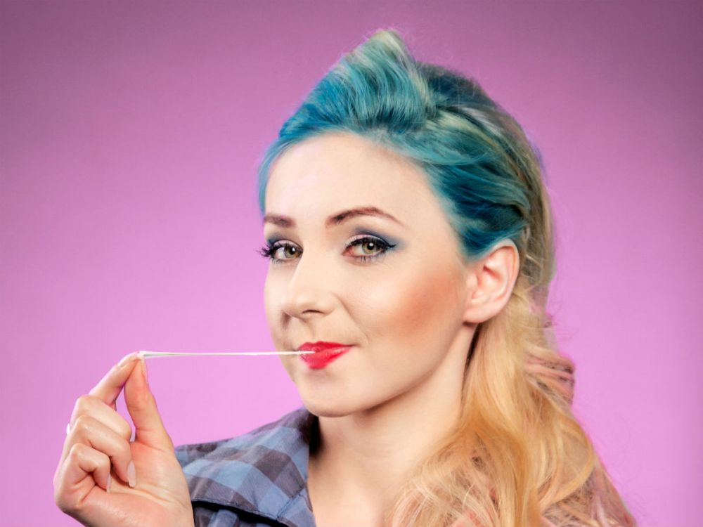 Young woman chewing gum